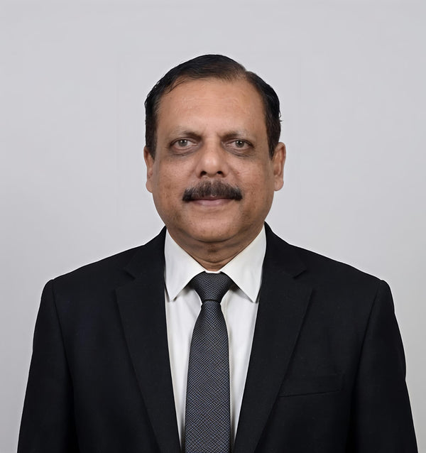 Dr. John K George